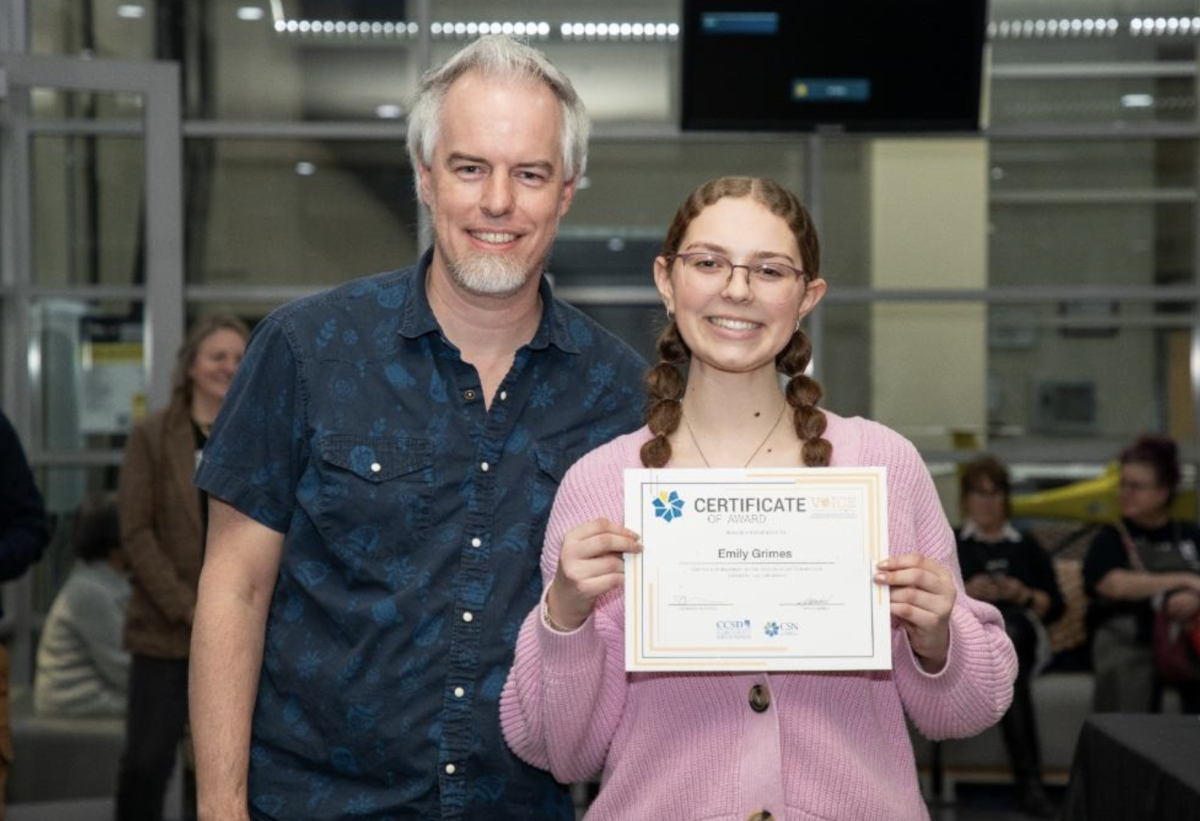 Emily Grimes and Mr. Counts with her certificate 